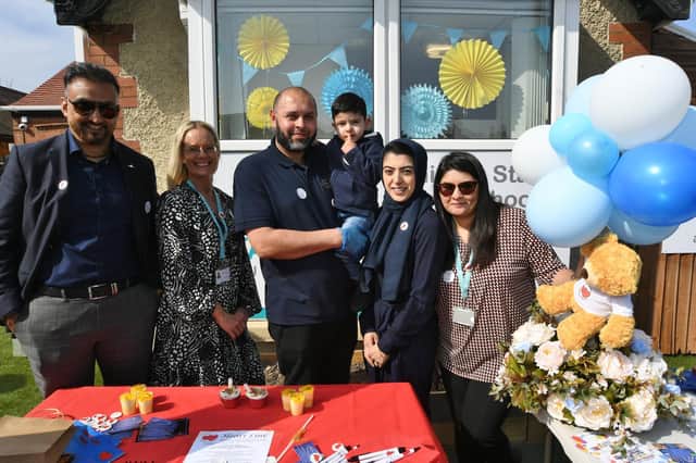 Maivesh and Azher Rafiq with their son Musa, three, taking part in a fundraising day at the Shining Stars Pre-School, with director Mohammed Ashraf, business manager Lora Pizzo and manager Nuzhat Lilani.