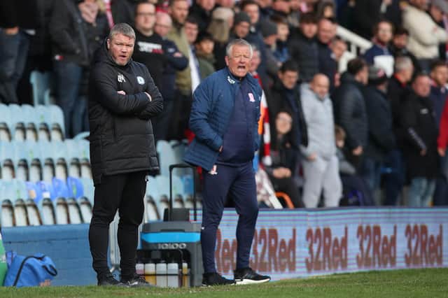 Peterborough United manager Grant McCann alongside Middlesbrough Manager Chris Wilder. Photo: Joe Dent/theposh.com.