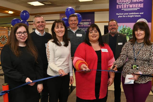 Anne Worthington cuts the tape to open the new Business and Intellectual Property Centre at the Central Library with her stakeholders and partners EMN-220104-161904009