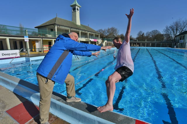 Opening of the Lido - FIRST in the pool this season MP for Peterborough Paul Bristow -  pushed in by Lido opening day ever-present John Peach EMN-220204-104047009