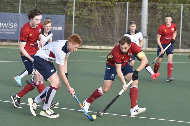 Joe Finding (red) scored twice for City of Peterborough at Birmingham University.
