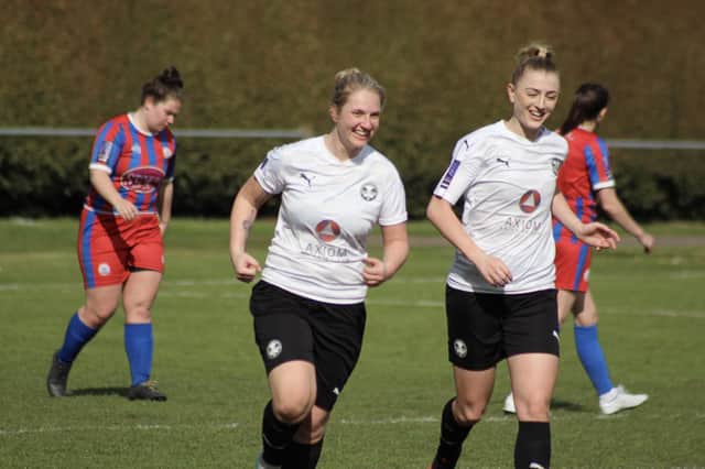 Two-goal Stacey McConville and top scorer Keir Perkins are all smiles as Posh Women win 5-0 at Wem Town. Photo: Gary Reed.
