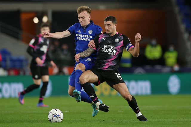 Oliver Norburn in action for Posh.