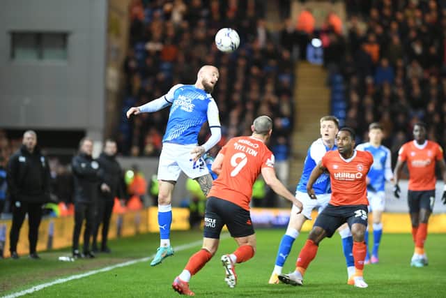 Joe Ward heads clear against Luton. Photo: David Lowndes.