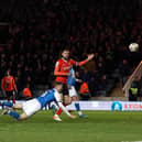 Jack Taylor of Peterborough United heads over against Luton Town late in the game. Photo: Joe Dent/theposh.com