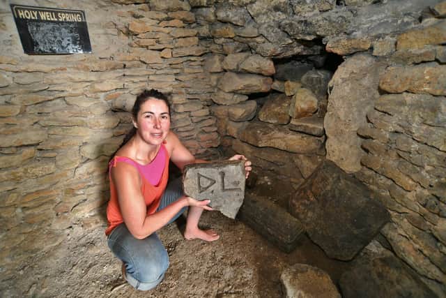 Samia Merrington, 42, found the inscriptions while clearing the main pond at Holywell Ponds.