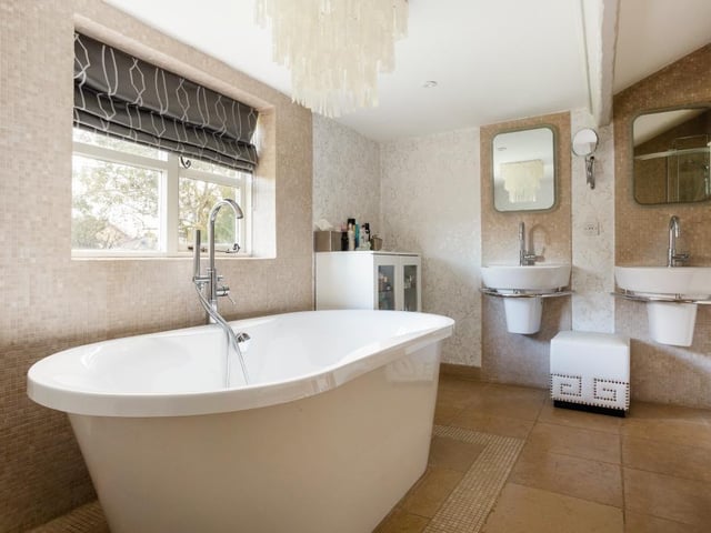 The bedrooms are served by three bath or shower rooms.