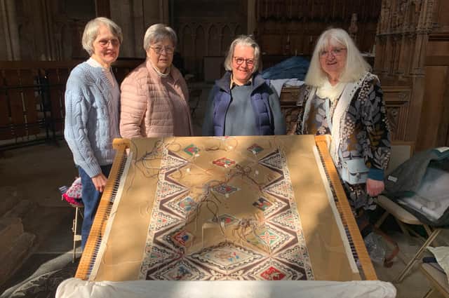 A team of dedicated women are hoping more volunteers will help them to finish a five metre long needle-point embroidery of Peterborough Cathedral’s nave ceiling.