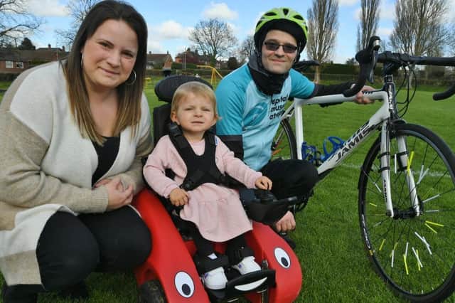 Spinal Muscular Atrophy sufferer Katie Dove, 2, with mum Sarah and sponsored cyclist Paul Yates who did 78 mile cycle ride for the SMA charity (image: David Lowndes)