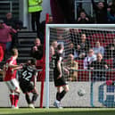 Rob Atkinson of Bristol City heads in the opening goal against Peterborough United. Photo: Joe Dent/theposh.com.