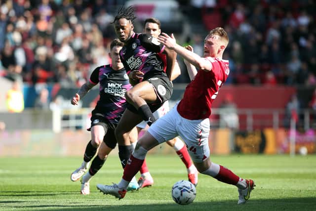 Ricky-Jade Jones of Peterborough United in action with Robbie Cundy of Bristol City. Photo: Joe Dent/theposh.com.