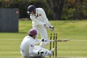 David Clarke falls after an impressive 78 for Peterborough Town against Wollaton. Photo: David Lowndes.