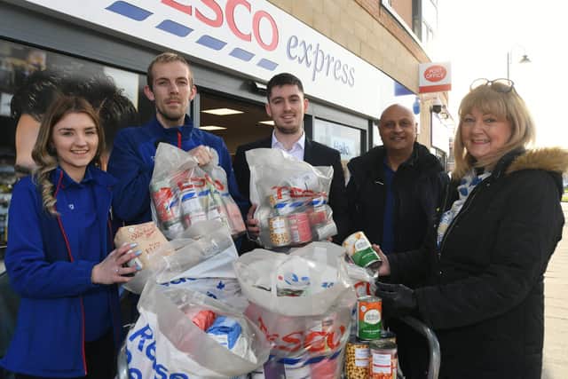 Supplies for Ukraine donated by Tesco, Hampton  -  staff Chloe Smalley, Liam Wigg and store manager Sam Jones with Tesco community champion Ejaz Moghul and fundraiser Jackie Fletcher-Keighley EMN-220904-155948009