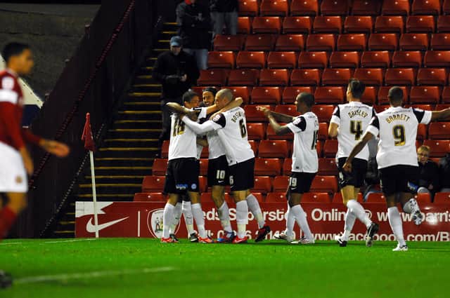 Posh celebrate a goal for George Boyd at Barnsley in 2012.