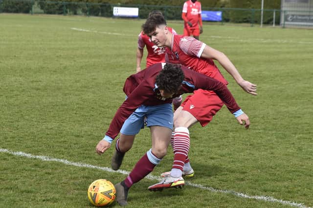 Action from Deeping Rangers Reserves' League Cup quarter-final win over Stilton United (red). Photo: David Lowndes.