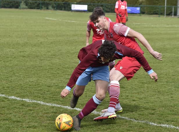 Action from Deeping Rangers Reserves' League Cup quarter-final win over Stilton United (red). Photo: David Lowndes.