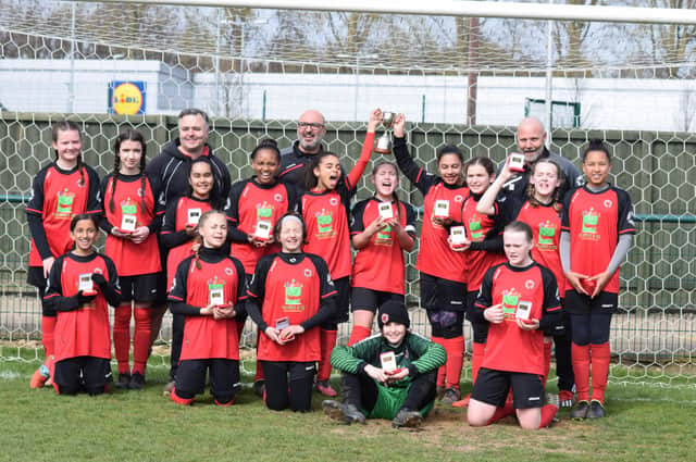 Netherton United Under 12s celebrate their Northants County Cup Final success.