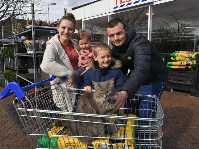 Kyle Orange, 33 (right), Korban Orange, 7 (centre), Rosie Orange, 0 (centre) and Danielle Fincahm, 29 (left) - with Frank outside Tesco in Werrington.