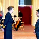 Zillur Hussain receives his MBE from Princess Anne.