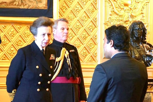 Zillur Hussain receives his MBE from Princess Anne.