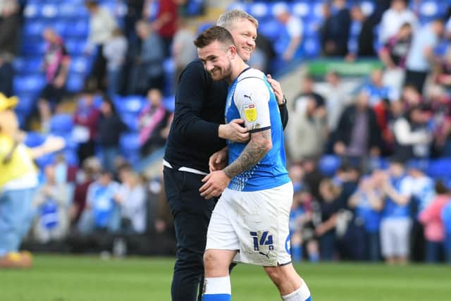 Posh boss Grant McCann and matchwinner Jack Marriott embrace after the win over Blackburn.  Photo: David Lowndes.