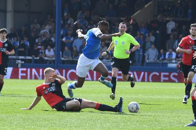 Posh forward Ricky-Jade Jones is tackled in the game against Blackburn. Photo: David Lowndes.