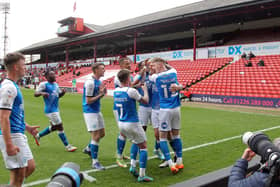 Jack Taylor (left of main group) tries to tell his teammates that he actually scored the second Posh goal at Barnsley. Photo: Joe Dent/theposh.com.