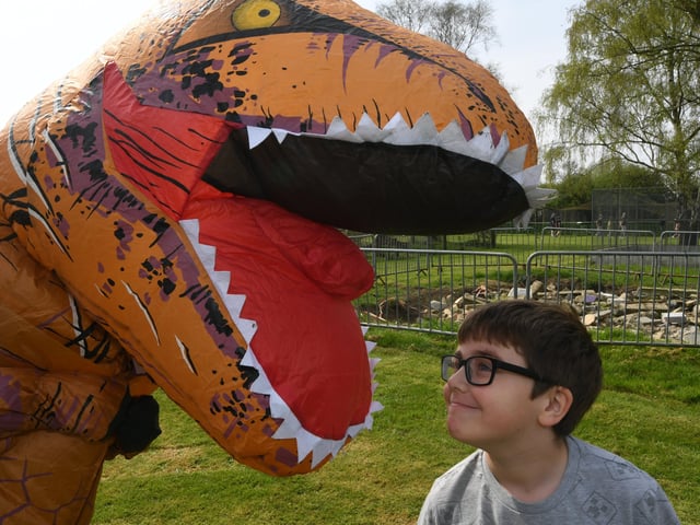 Open day at the Exotic Pets Refuge at Deeping St James. Oaklee Page-Banks (7) with a dinosaur. EMN-220417-131527009