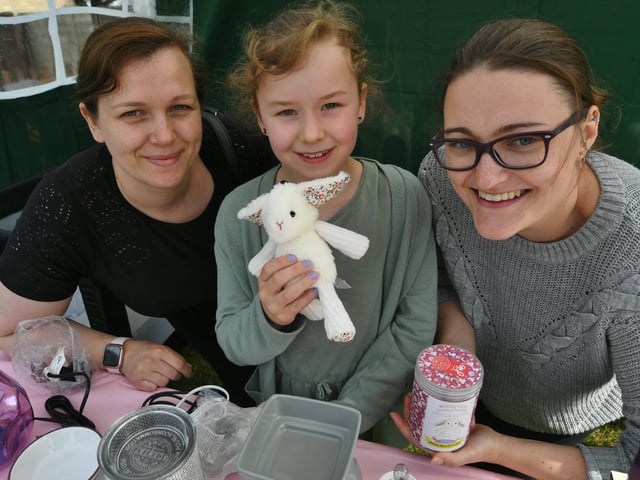 Open day at the Exotic Pets Refuge at Deeping St James. Mollie and Eliza (8) Shaw with volunteer Lorna Perry EMN-220417-131443009