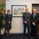 From left to right: Squadron Leader Al Auchterlonie, Wing Commander Maggie Boyle, local artist Mr Mark Whitaker, Warrant Officer Dave Lowe.