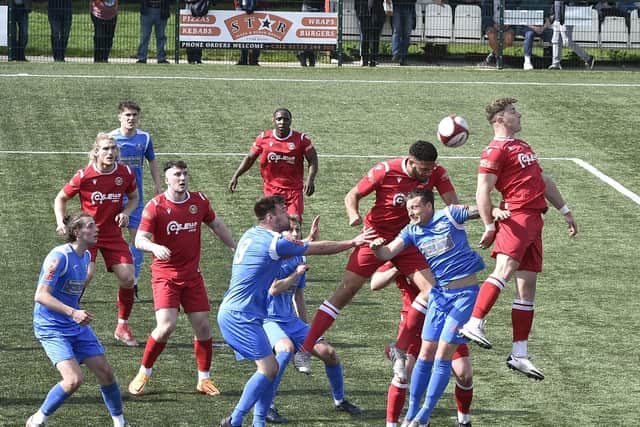 Action from Yaxley (blue) v Stamford AFC. photo: David Lowndes.