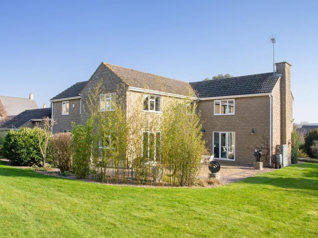 The house has landscaped gardens within almost an acre plot.