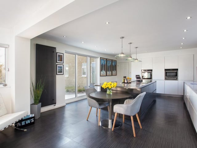 Aside from the kitchen, the space also benefits from a utility room with a larder.