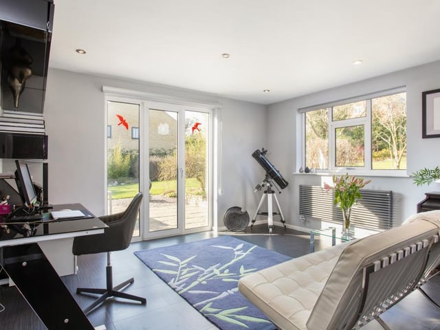 One of the three reception rooms has been turned into an office.