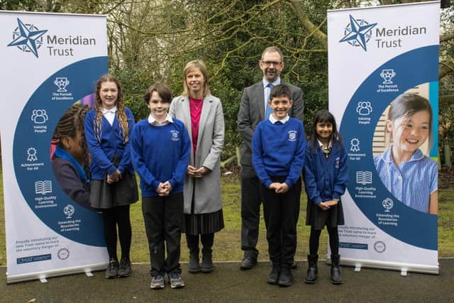 Lesley Birch (Meridian Trust, Deputy CEO) and Mark Woods (Meridian Trust, CEO) with pupils from Hatton Park Primary School.