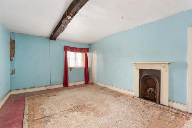 Original fireplaces dating back hundreds of years have been maintained in rooms throughout the home.