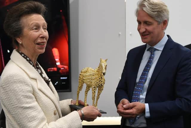 Photocentric managing director Paul Holt presents Princess Anne with a gold horse last year that was made using processes that could transform manufacturing as the company leads on an Innovate UK project to help the UK hit its 2050 carbon neutral target. EMN-210920-142643009