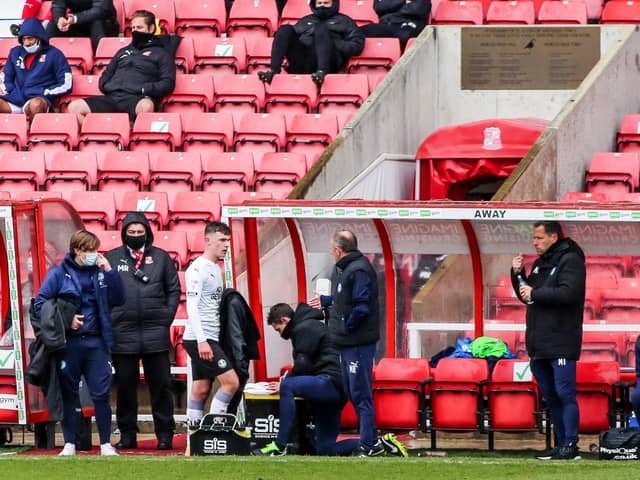 Posh teenager Harrison Burrows troops off after his substitution at Swindon. Photo: Joe Dent/theposh.com.