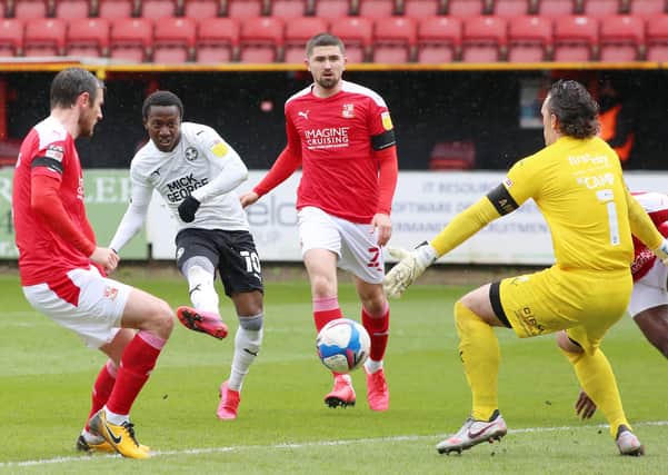 Siriki Dembele of Peterborough United scores his second goal of the game against Swindon Town. Photo: Joe Dent/theposh.com.