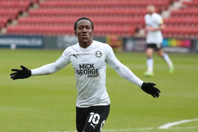 Siriki Dembele of Peterborough United celebrates scoring his second goal of the game against Swindon Town. Photo: Joe Dent/theposh.com.