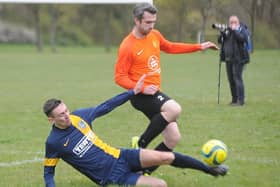 Glinton & Northborough (blue) and Stamford Bels Reserves do battle in the Peterborough Junior Cup at the weekend. Bels won 6-1. Photo: David Lowndes.