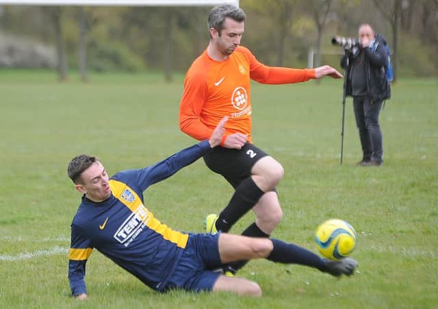 Glinton & Northborough (blue) and Stamford Bels Reserves do battle in the Peterborough Junior Cup at the weekend. Bels won 6-1. Photo: David Lowndes.