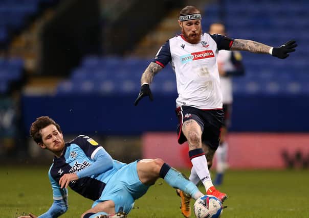Marcus Maddison in action for Bolton against Cambridge United.