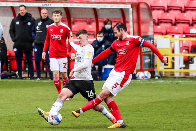 Harrison Burrows (white) in action for Posh at Swindon. Photo: Joe Dent/theposh.com.
