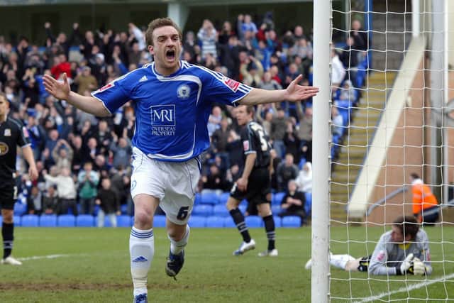 Charlie Lee celebrates a match-winning goal for 10-man Posh against Cobblers at London Road in 2009.