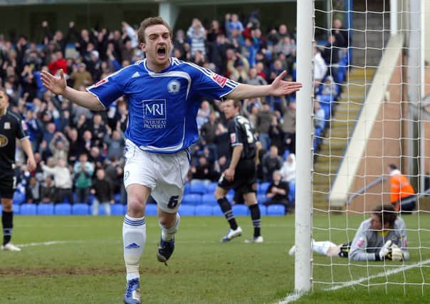 Charlie Lee celebrates a match-winning goal for 10-man Posh against Cobblers at London Road in 2009.