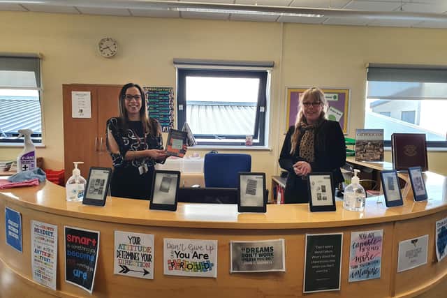 Chief of Administration Rosie Roe and SENCO Lead Jo Sennett with the book in the school's study centre.