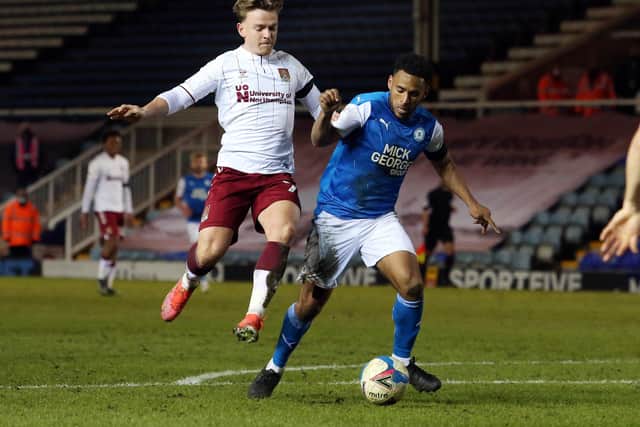 Nathan Thompson Peterborough United is fouled by Sam Hoskins of Northampton Town for a penalty. Photo: Joe Dent/theposh.com.
