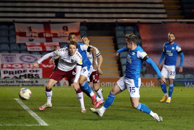Sammie Szmodics of Peterborough United scores the opening goal against Northampton Town. Photo: Joe Dent/theposh.com.