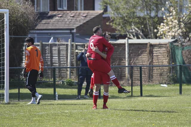 Luke Steele (far) celebrates a goal for Peterborough Northern Star Reserves against FC Peterborough. Photo: Tim Symonds.